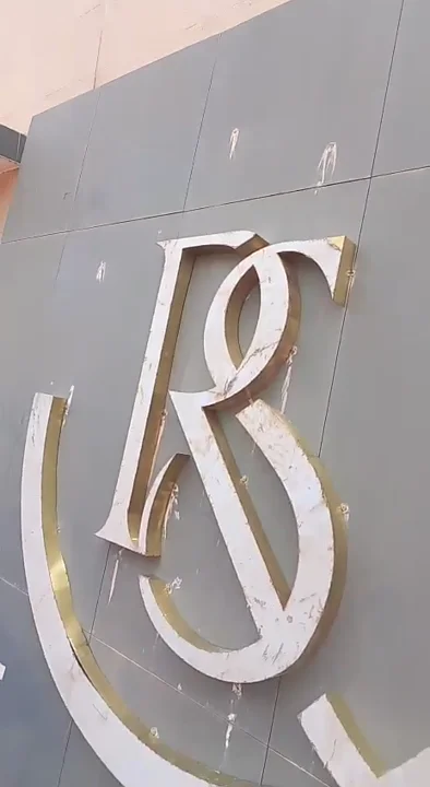 Solid brass monogram waterjet cutting and hand polishing