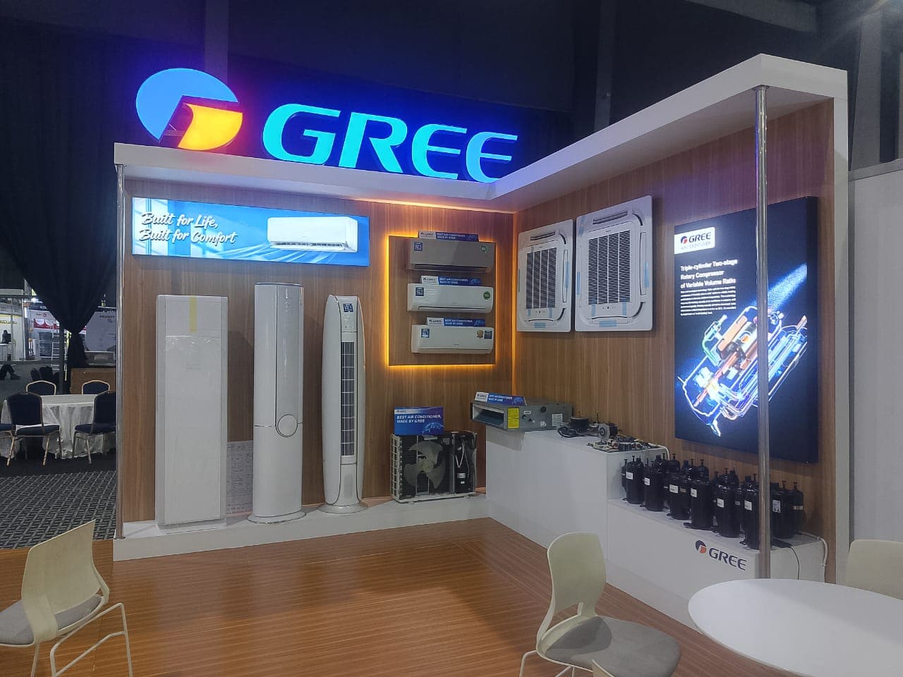GREE commercial trade exhibition stand with illuminated 3D logo and product showroom.