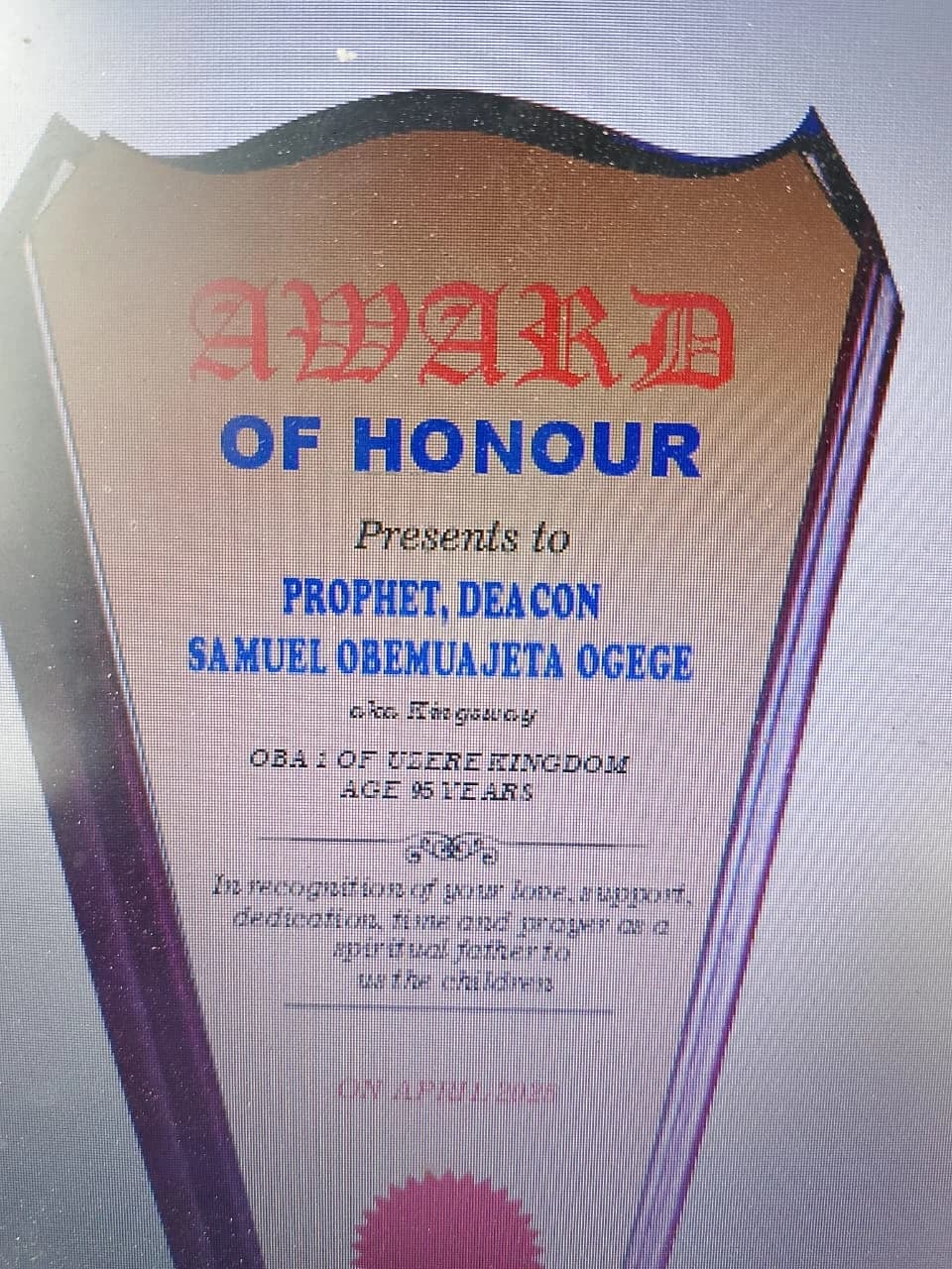 Lacquered mahogany wooden award plaque with printed gold aluminium plate for Oba 1 of Uzere Kingdom.