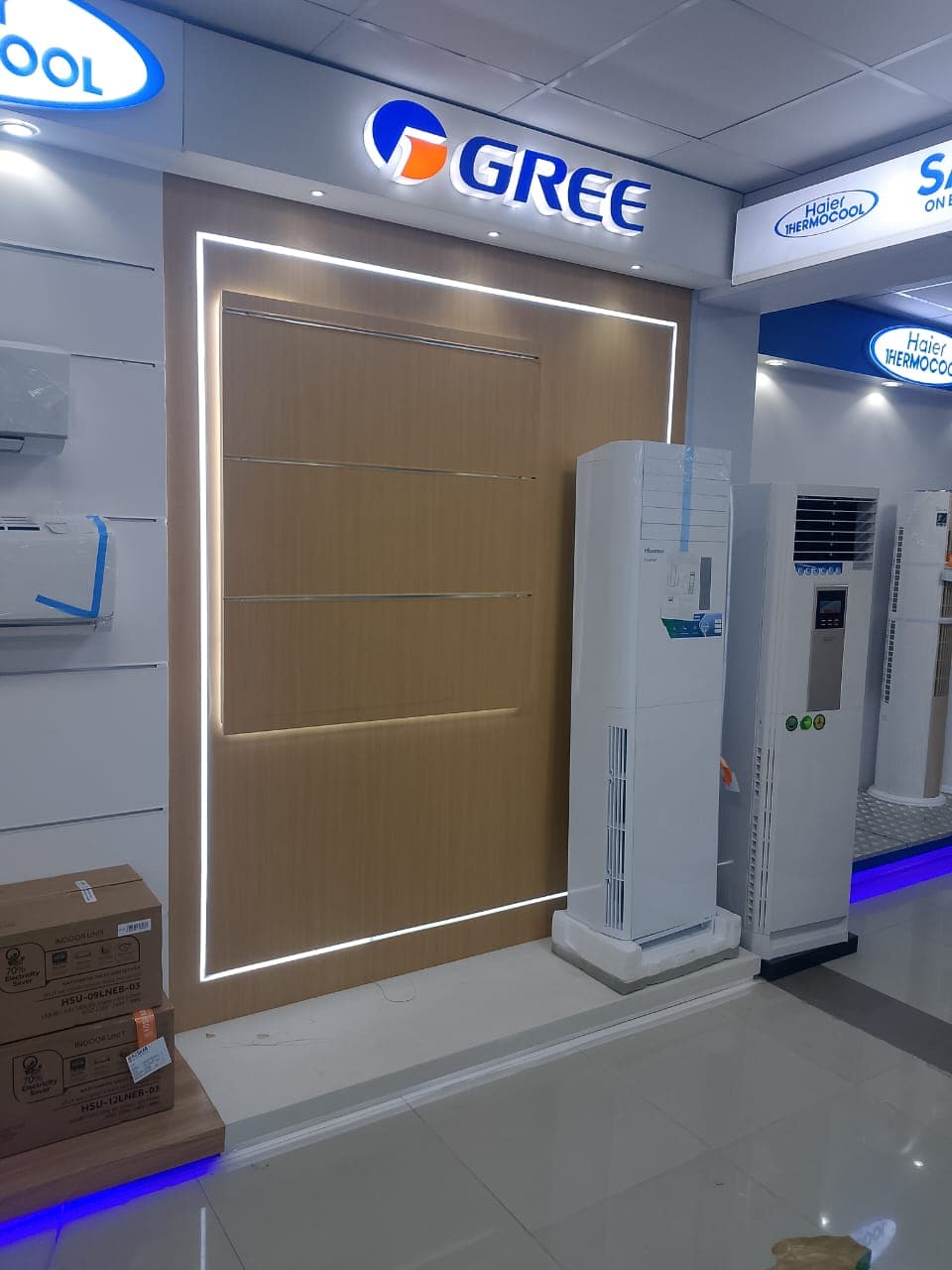 Modular L-shaped exhibition reception counter for GREE trade display.
